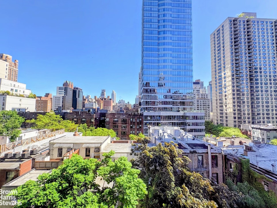 235 East 73rd Street, Unit 8D Manhattan, NY 10021 - Photo 10 of 12 a view of a city with tall buildings