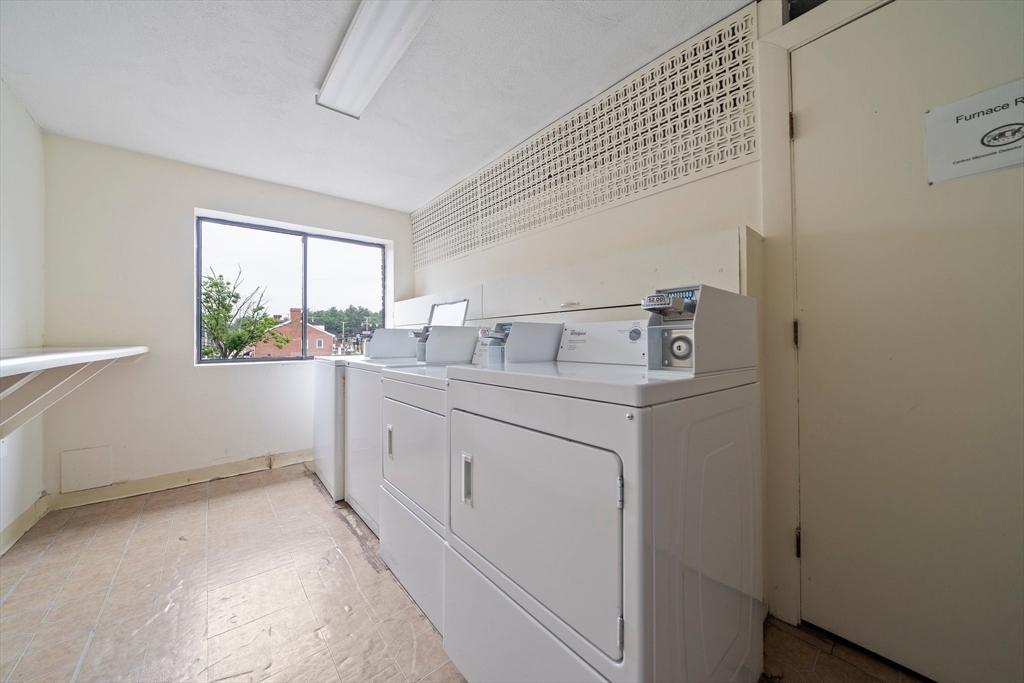 915 Edgell Road, Unit 77 Framingham, MA 01701 - Photo 12 of 15 a utility room with dryer and washer