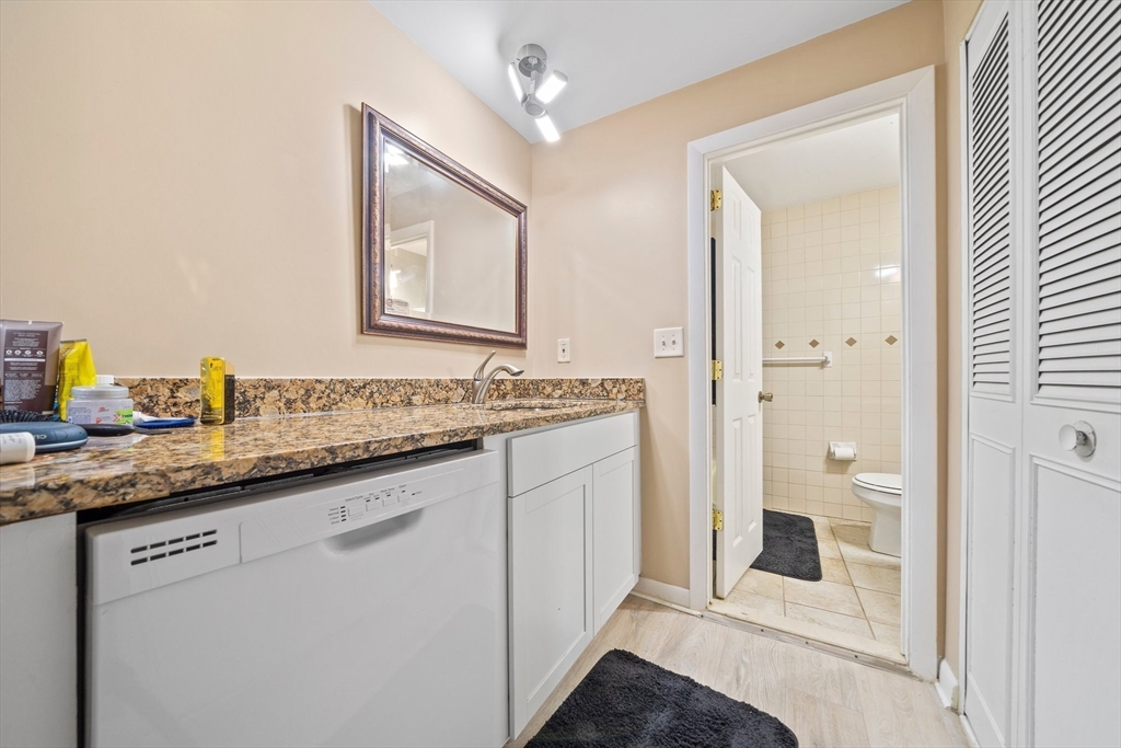 915 Edgell Road, Unit 77 Framingham, MA 01701 - Photo 10 of 15 a bathroom with a sink and a mirror