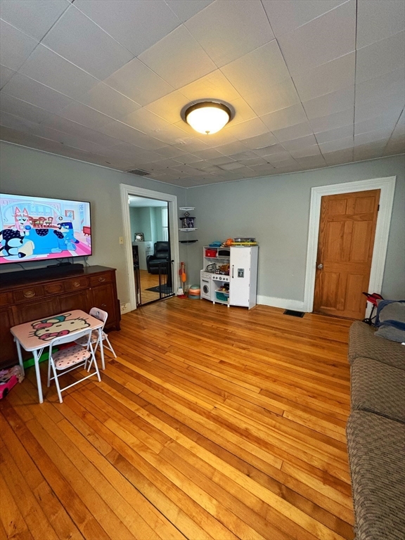 8 Water Street Greenfield, MA 01301 - Photo 12 of 21 a room with wooden floor and furniture