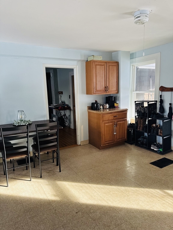 8 Water Street Greenfield, MA 01301 - Photo 4 of 21 a living room with furniture a piano and a window