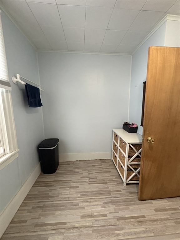 8 Water Street Greenfield, MA 01301 - Photo 9 of 21 a view of an empty room with wooden floor and a window