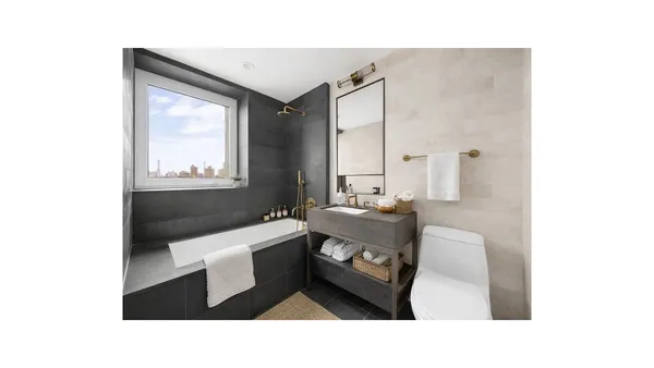 a en suite bathroom with a sink and a mirror