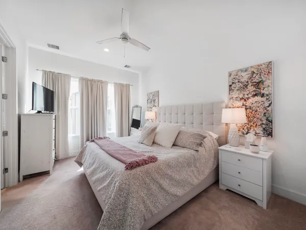 a bedroom with a bed and a couch