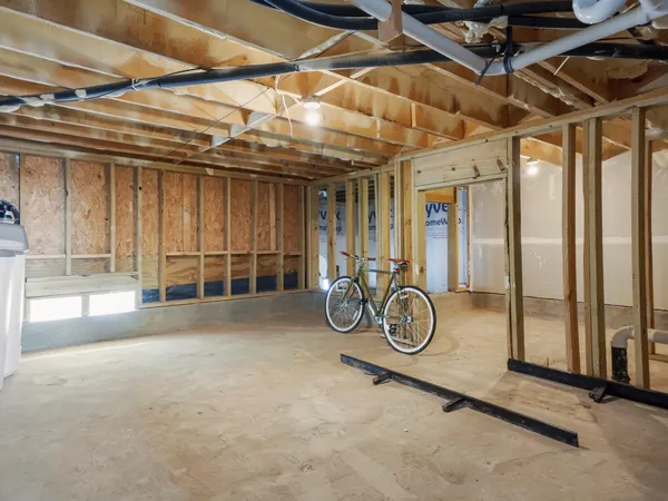 a view of garage with wooden walls