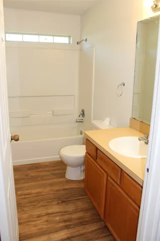 a view of hallway with wooden floor