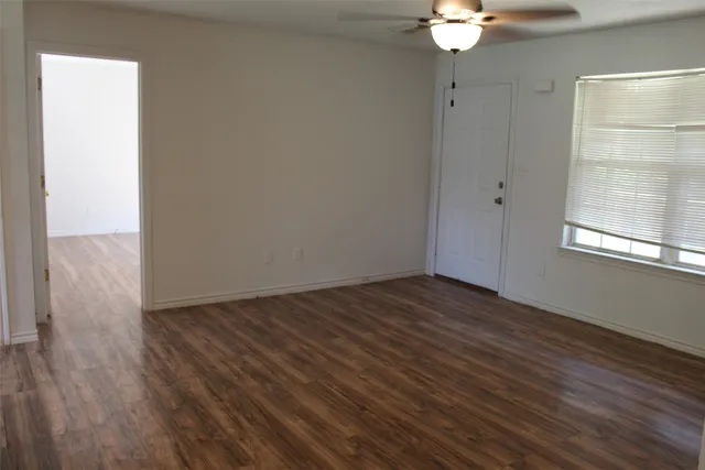 an aerial view of a golf course with parking space