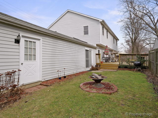 318 East Elm Street Wheaton, IL 60189 - Photo 16 of 17 a front view of a house with a yard
