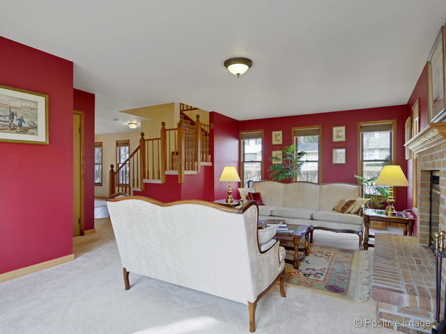 318 East Elm Street Wheaton, IL 60189 - Photo 3 of 17 a living room with furniture a rug and a floor to ceiling window