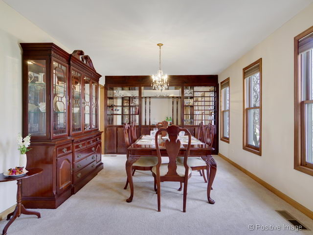 318 East Elm Street Wheaton, IL 60189 - Photo 4 of 17 a view of a dining room with furniture window and wooden floor