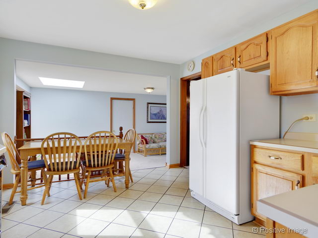 318 East Elm Street Wheaton, IL 60189 - Photo 7 of 17 a view of a refrigerator and chair