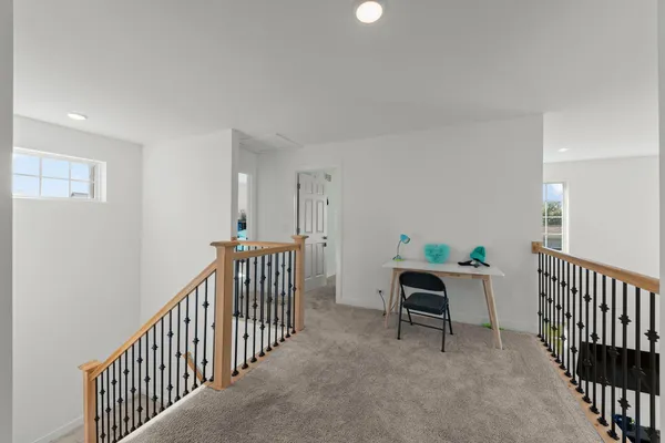 a view of a hallway with windows