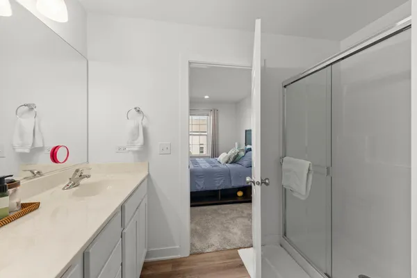 a en suite bathroom with a sink and a mirror