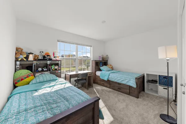 a bedroom with furniture and a bed