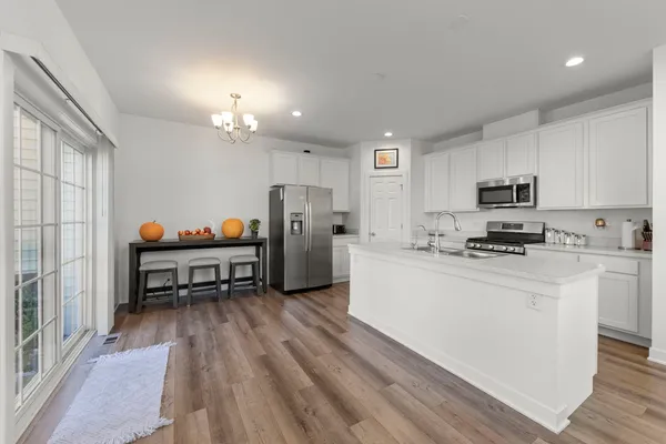 a kitchen with stainless steel appliances refrigerator stove microwave and cabinets