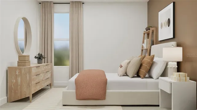 a bedroom with a bed and a mirror