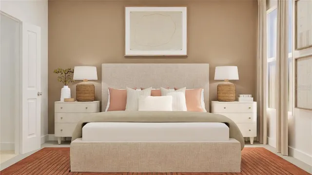 a bedroom with a large bed and a dresser