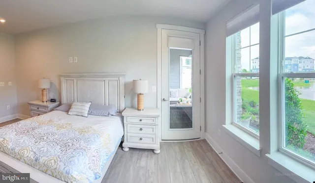 a bedroom with a bed and a dresser in it