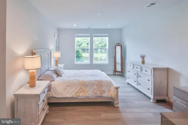 a bathroom with a shower sink and mirror