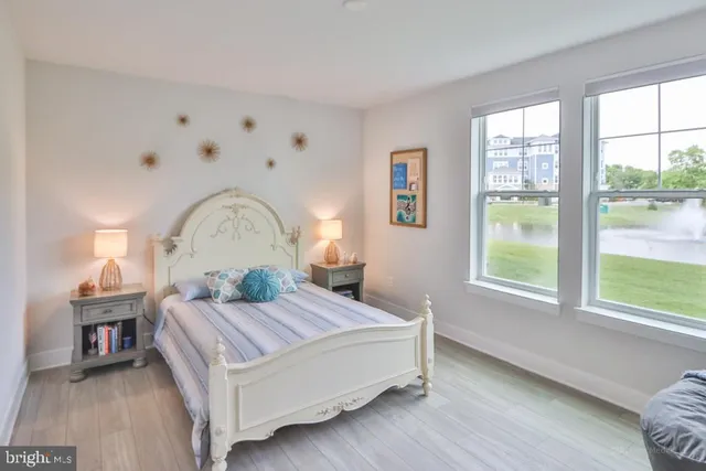 a spacious bathroom with a sink and a mirror