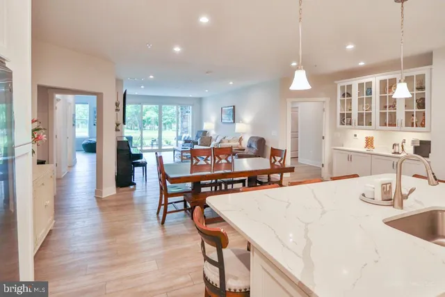 a large kitchen with a table and chairs