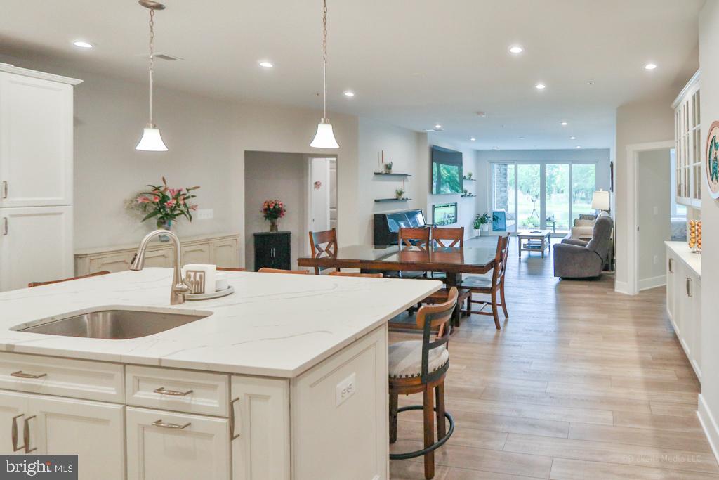 190 Harrier Way, Unit 11 Chester, MD 21619 - Photo 10 of 32 a large kitchen with a table and chairs