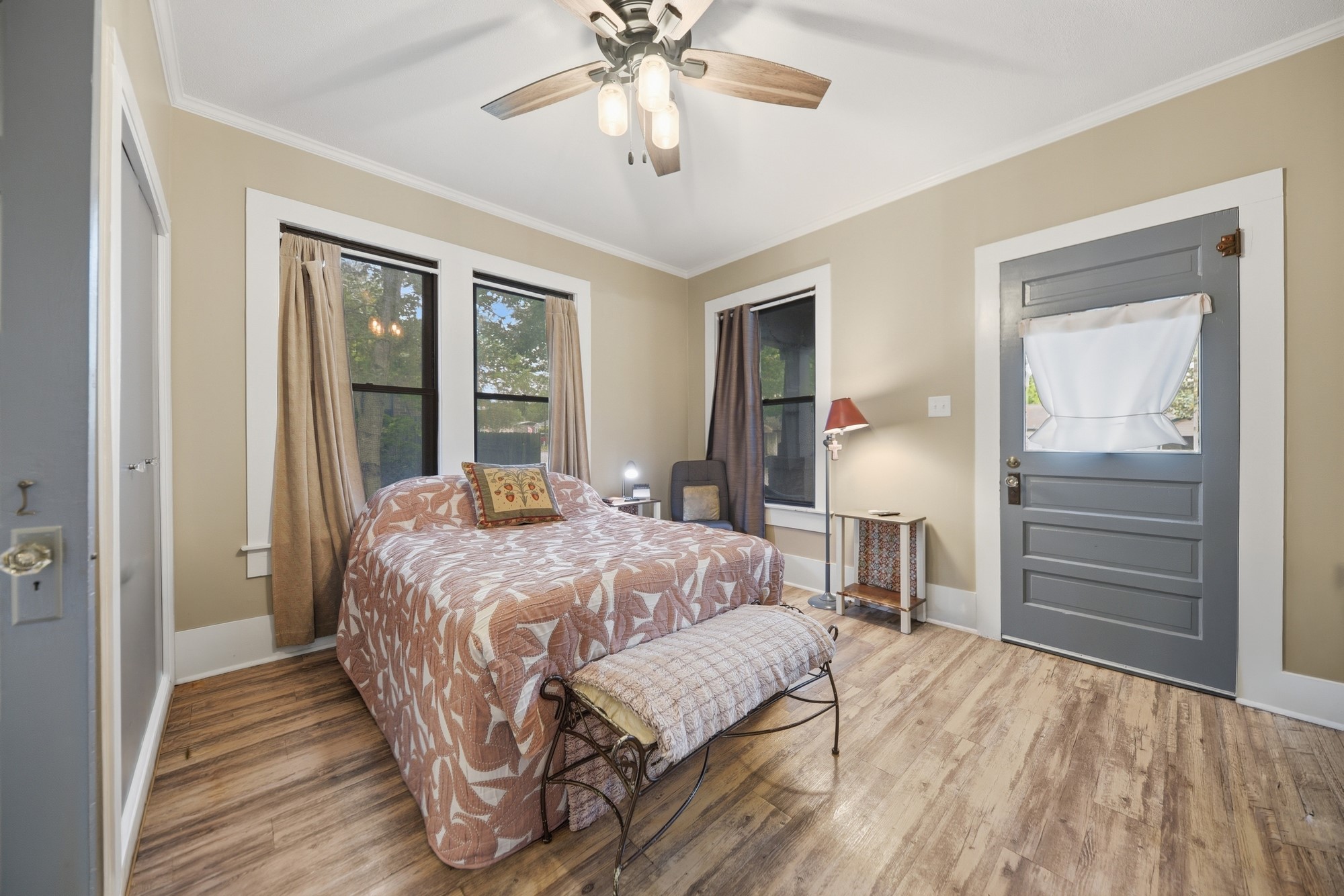 1501 South Austin Street Brenham, TX 77833 - Photo 12 of 36 a bedroom with a bed and a chandelier