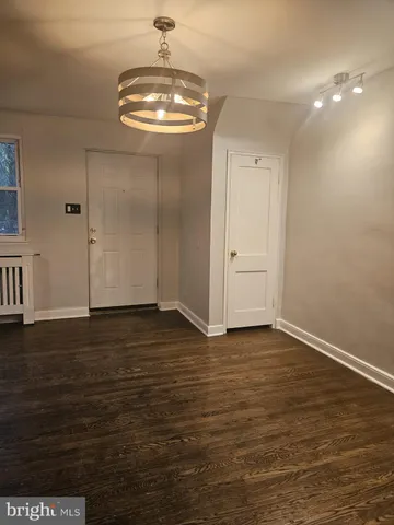 a view of a livingroom with wooden floor