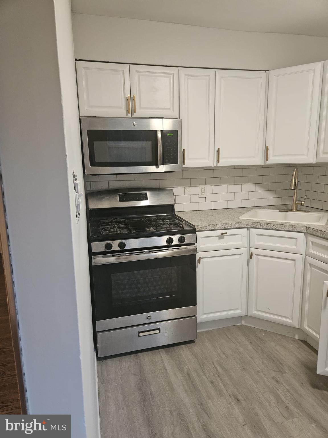 6312 North 10th Street, Unit 1 Philadelphia, PA 19141 - Photo 4 of 8 a kitchen with cabinets and appliances