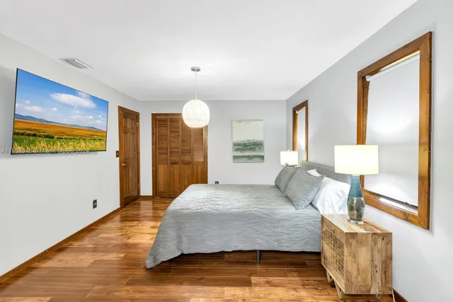 a bedroom with a bed and a couch