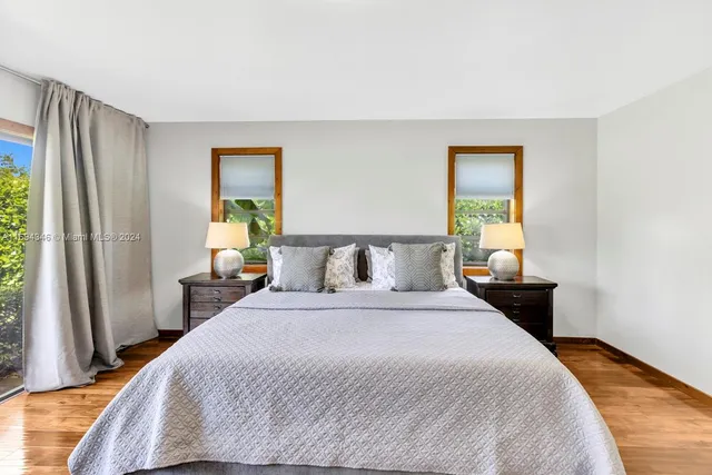 a view of a porch with furniture and floor to ceiling window