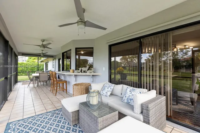 a view of a house and a yard and entertaining space