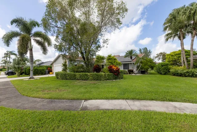 a view of a lake with houses in the background