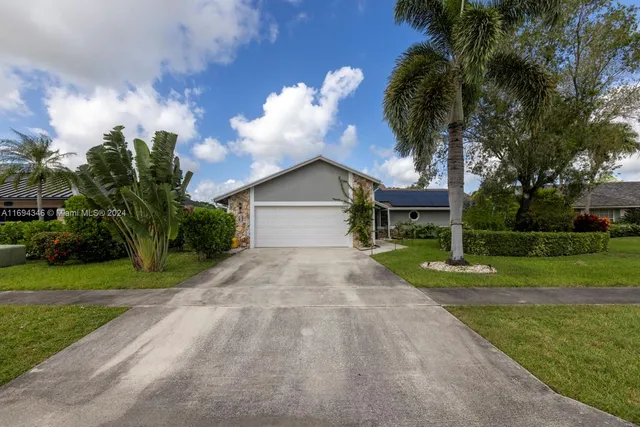 a view of a garden with houses