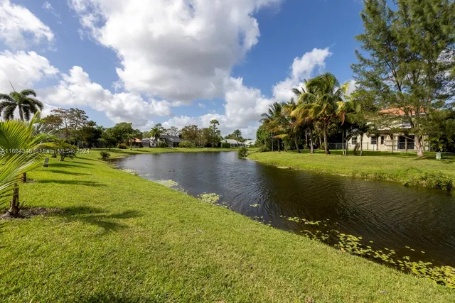 an aerial view of a house a yard and outdoor seating