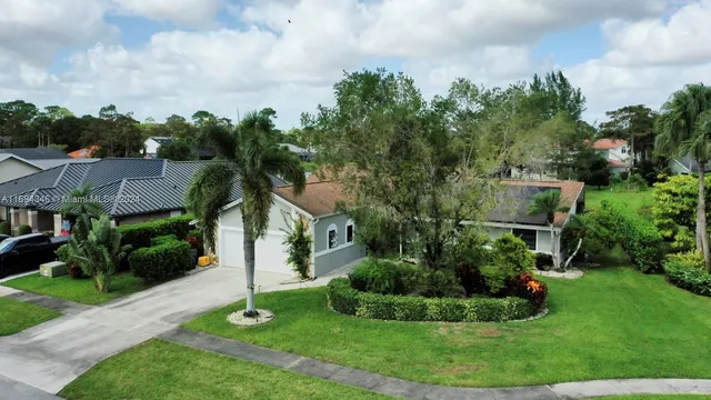 an aerial view of house with yard