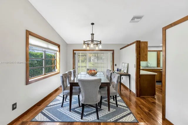 a kitchen with lots of counter top space and stainless steel appliances