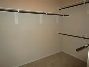 a bathroom with a double vanity sink and mirror