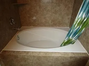 a bathroom with a shower and a toilet