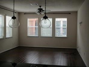 a kitchen with granite countertop wooden cabinets and stainless steel appliances