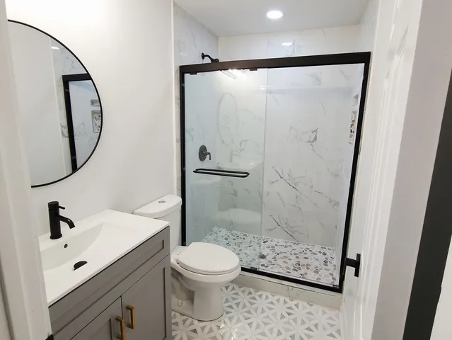 a bathroom with a shower and a toilet