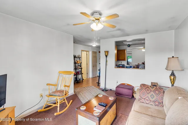 a bathroom with a granite countertop sink a toilet and a mirror