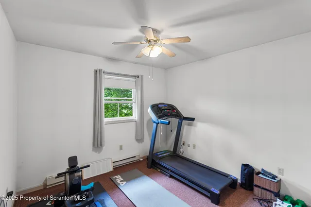 a room with furniture and gym equipment