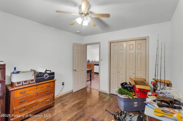 a view of a hallway to rooms and stairs