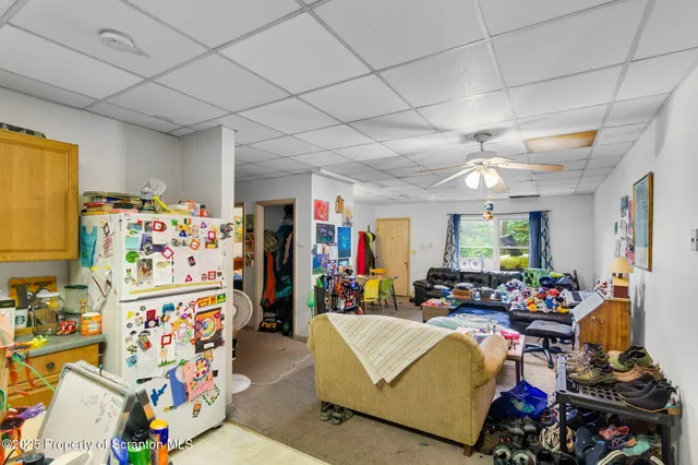 a kitchen with a sink cabinets and wooden floor