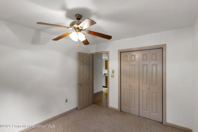 a view of a chandelier fan in a room
