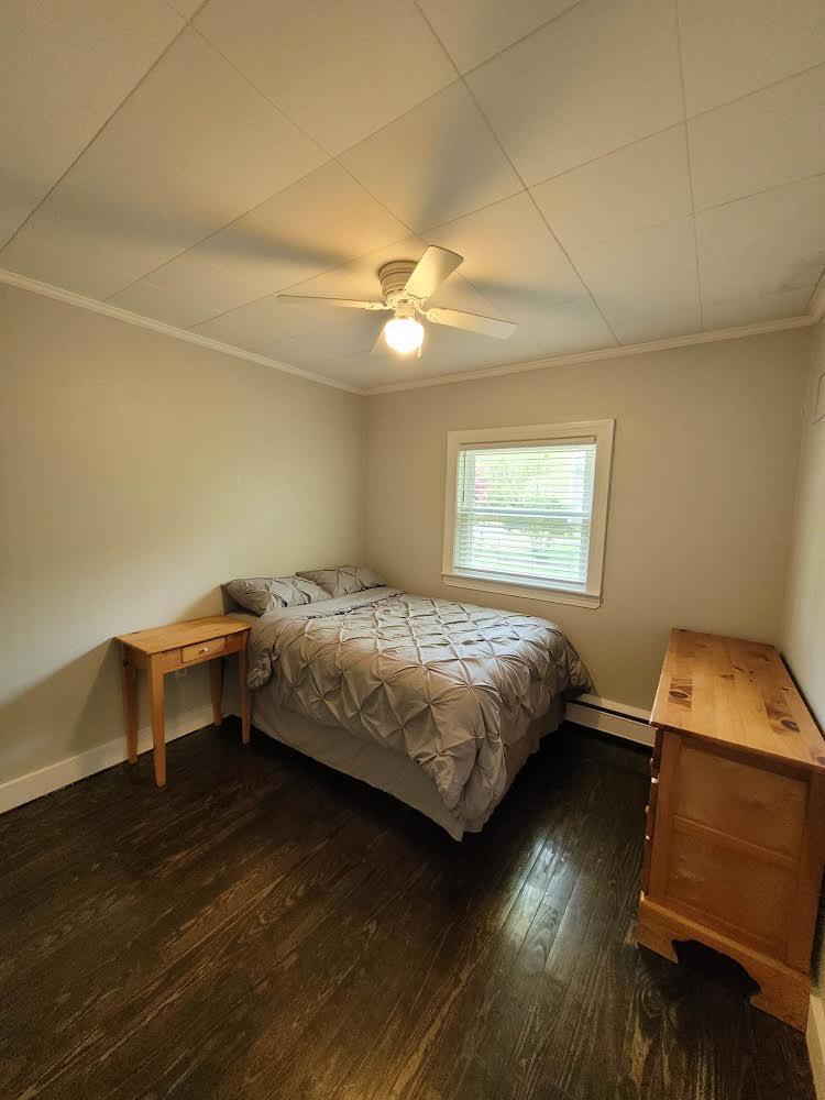 52 Ploughed Neck Road East Sandwich, MA 02537 - Photo 18 of 20 a bedroom with a bed and a chandelier