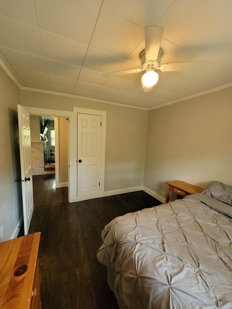 52 Ploughed Neck Road East Sandwich, MA 02537 - Photo 19 of 20 a bedroom with a bed and a chandelier