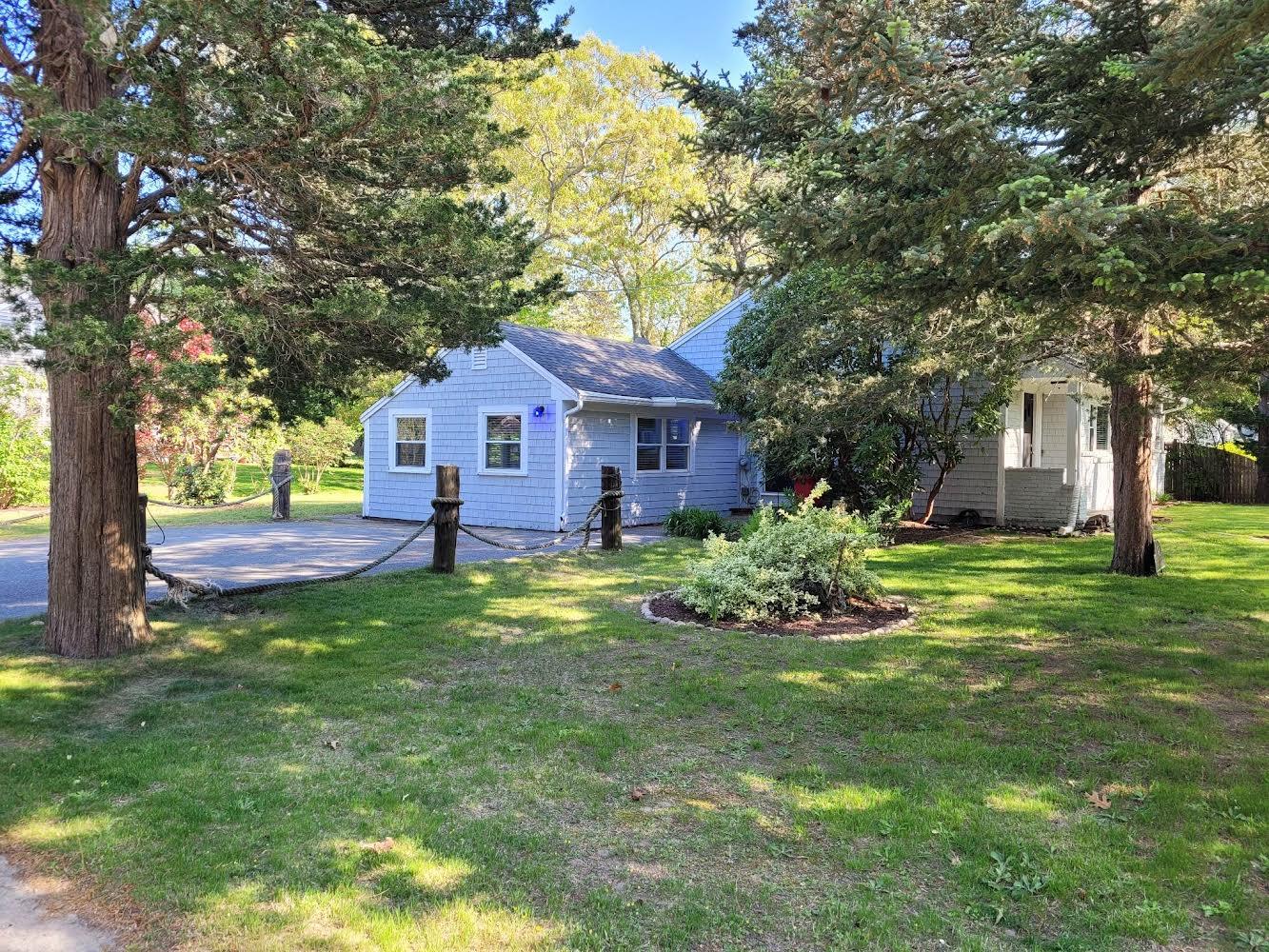 52 Ploughed Neck Road East Sandwich, MA 02537 - Photo 3 of 20 a house view with a garden space