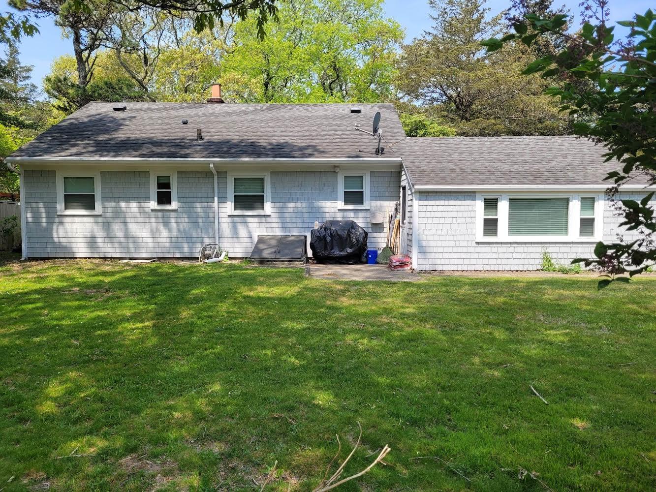 52 Ploughed Neck Road East Sandwich, MA 02537 - Photo 5 of 20 a front view of house with yard and green space